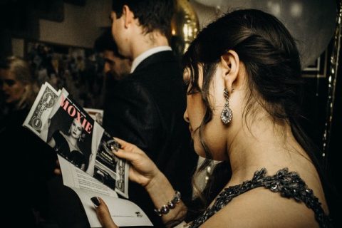 Night of Mystery | POM 4/18: Lights! Camera! MURDER!!! Old Hollywood Style a person reading a book