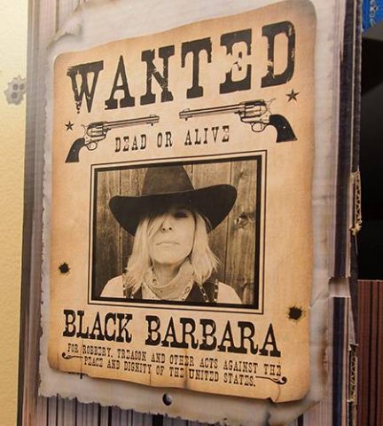 Night of Mystery | Saloon Party Decorations a sign on a building