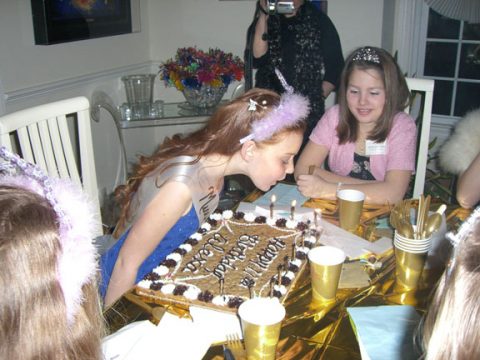 Night of Mystery | A Killer 11th Birthday Party a person blowing out candles on a cake