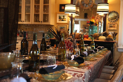 a table with many bottles of alcohol on it